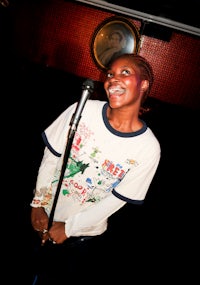 a woman holding a microphone